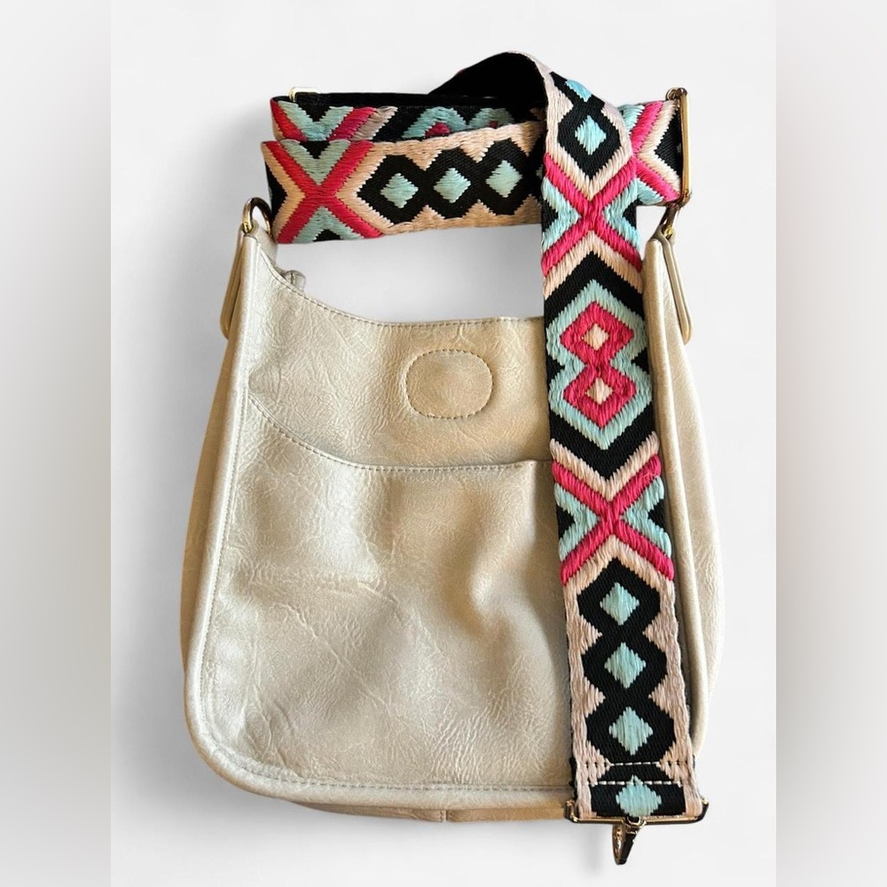 Ahdorned vegan leather mini messenger bag.